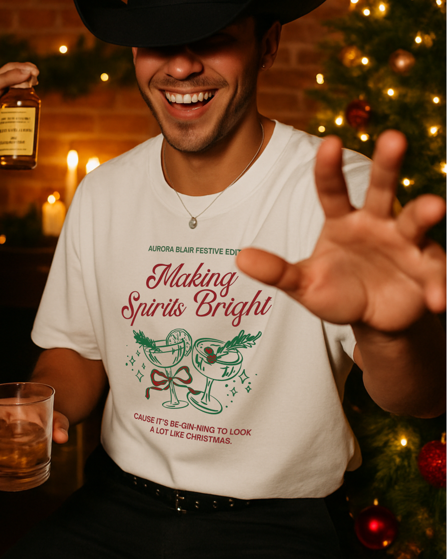 Man in cowboy hat holding a glass and bottle with Christmas decorations in the background
